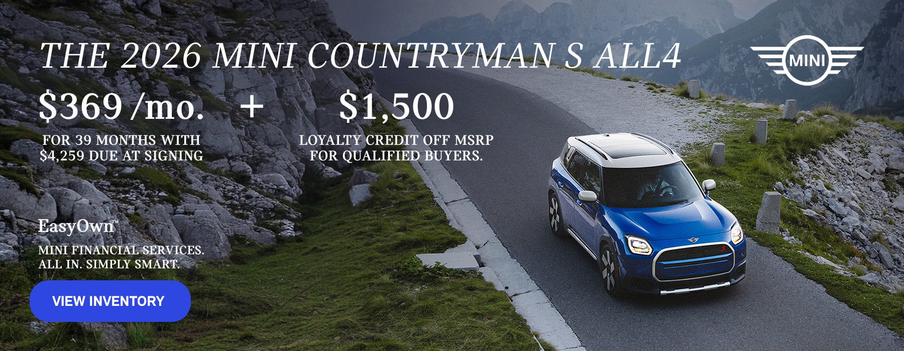 Front view of a blue MINI Countryman  driving on a mountainous road.