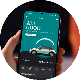 A hand holding up his phone with the MINI App open on the screen.