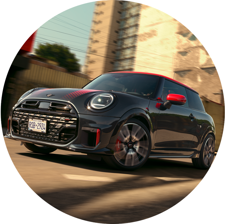 A low angled view of the MINI JCW 2 Door driving.